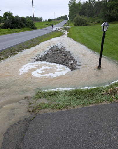 Rain dramatically overwhelming culvert