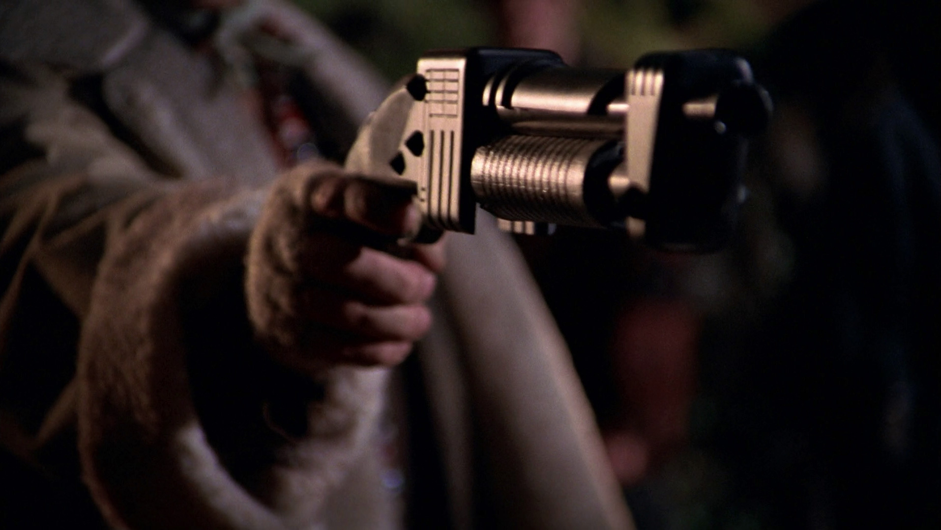 A closeup of Zefram Cochrane wielding a shotgun during first contact with the Vulcans in the Mirror Universe.