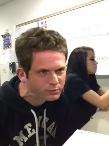 Image of a person with a strained expression, with the head of Dennis with a similarly strained expression