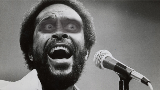 Marvin Gayeron singing his 2371 hit "What's Gowron On" in Quark's Bar, Grill, Gaming House, Holding Company and Holosuite Arcade.